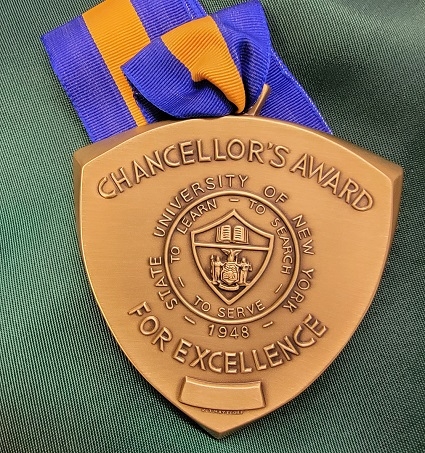 Gold Chancellor Medal on blue and gold ribbon