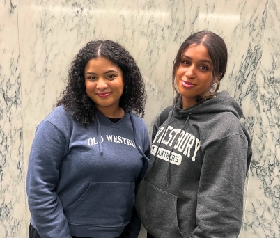 Photo of OW Students Destiny Williams (left) and Jasmine Roldan at in the Capitol Building for disability advocacy day.