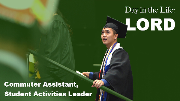 Day in the life: Lord. Commuter assistant, student activities leader. A latin male student in cap and gown climbing up stairs holding on to stair rail