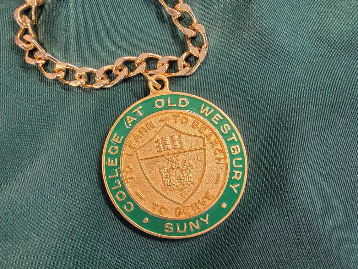 Green and gold president's medal on gold chain