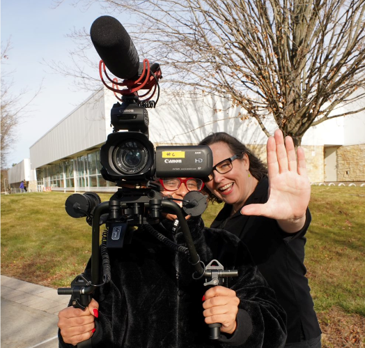 Professor Samara Smith showing a student camera skills