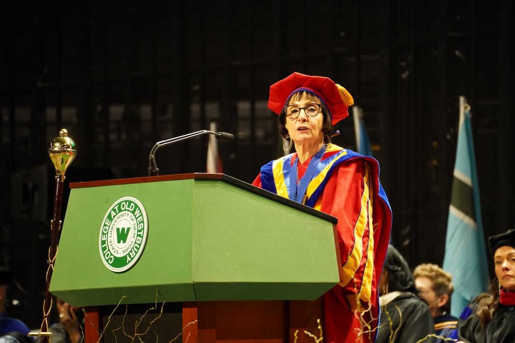 Dr. Anker at podium during Commencement