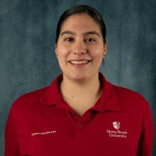 Rosanna Cuttone in a red Stony Brook University polo shirt