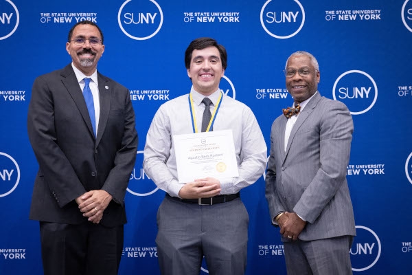 Photo of SUNY Chancellor John B. King, Jr., SUNY Chancellor Award winner Agustin Beas Romero and President Dr. Timothy E. Sams.