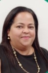 Hispanic woman wearing a gold necklace