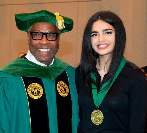 Photo of President Timothy Sams and President's Medal winner Pooja Aiyar