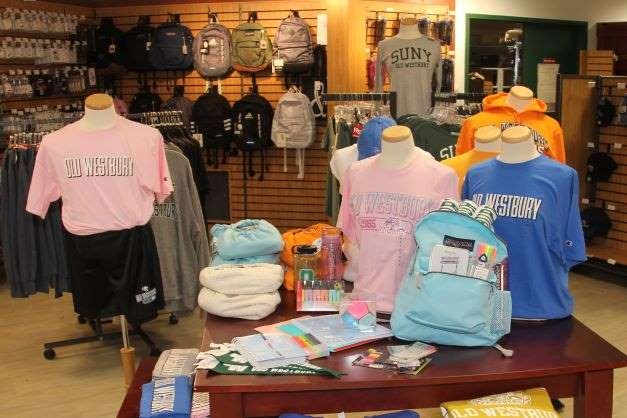 Racks of clothes with college logo