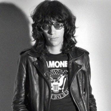 Male dressed in leather jacket with Ramones tee shirt