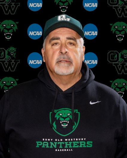 Older white man wearing a green baseball cap and a black hooded sweatshirt