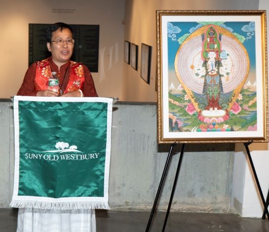 Woman of Asian descent speaks at a podium