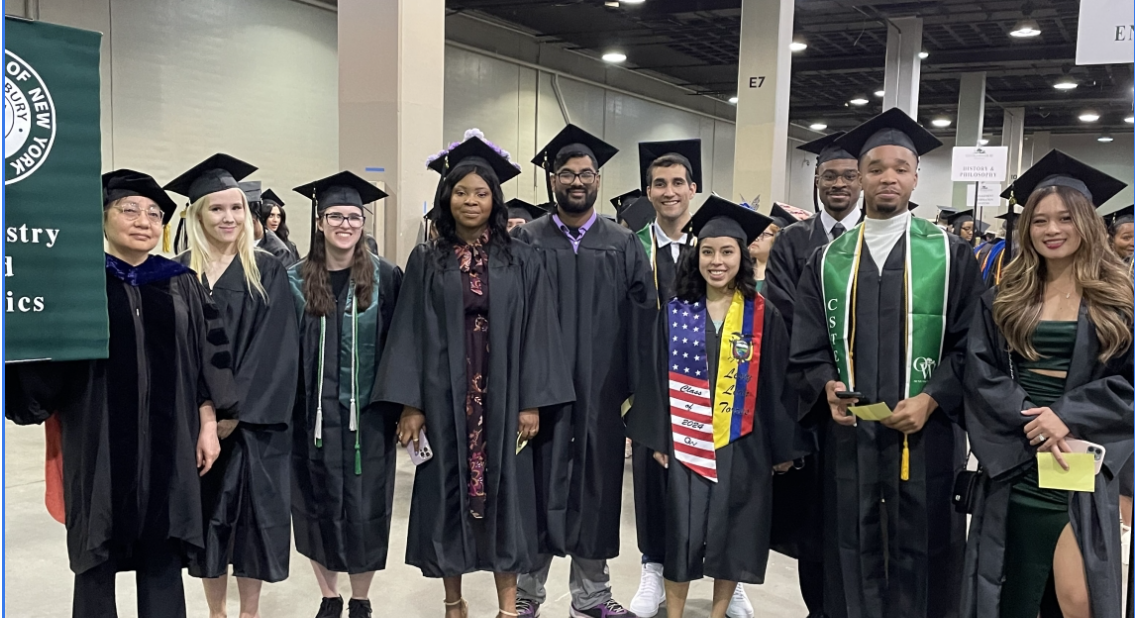 10 people in black caps and gowns