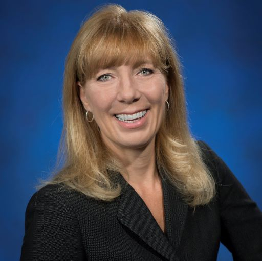 Smiling Caucasian woman with long blond hair in a formal business portrait