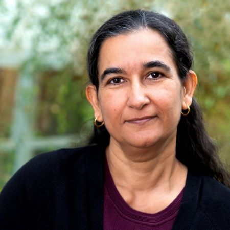 Woman of Indian descent wearing black blouse