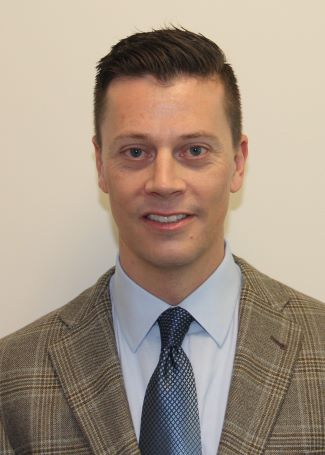 White male in sport coat and tie