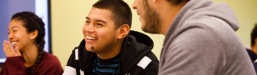 Three student laughing in class