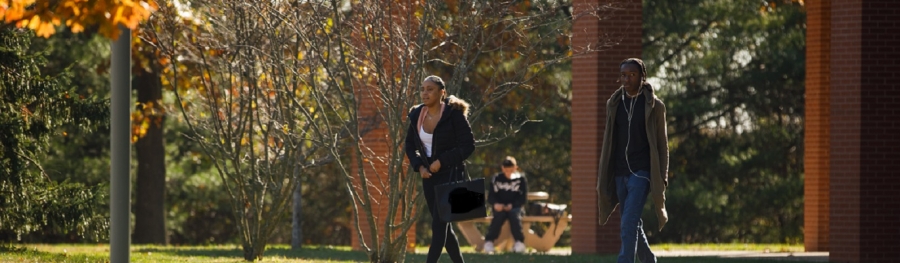 Two students walking outside NAB coffee shop