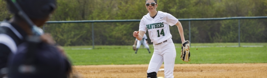 Softball pitcher throwing in a game