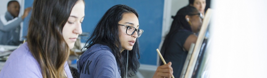 Two students in a painting class