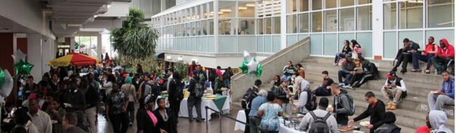 Students walking in the campus center atrium