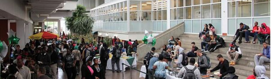 Students walking in the campus center atrium 