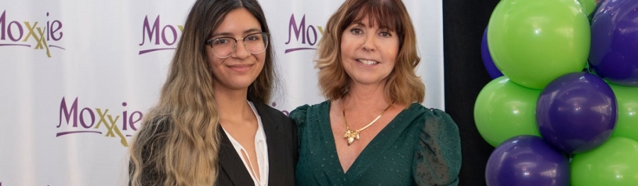 LeeAnn Williams accepts her award from Moxxie Founder and Executive Director Beth Meixner