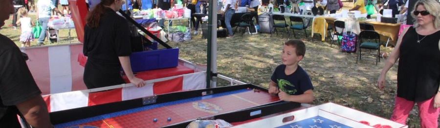 Child plays ring toss game