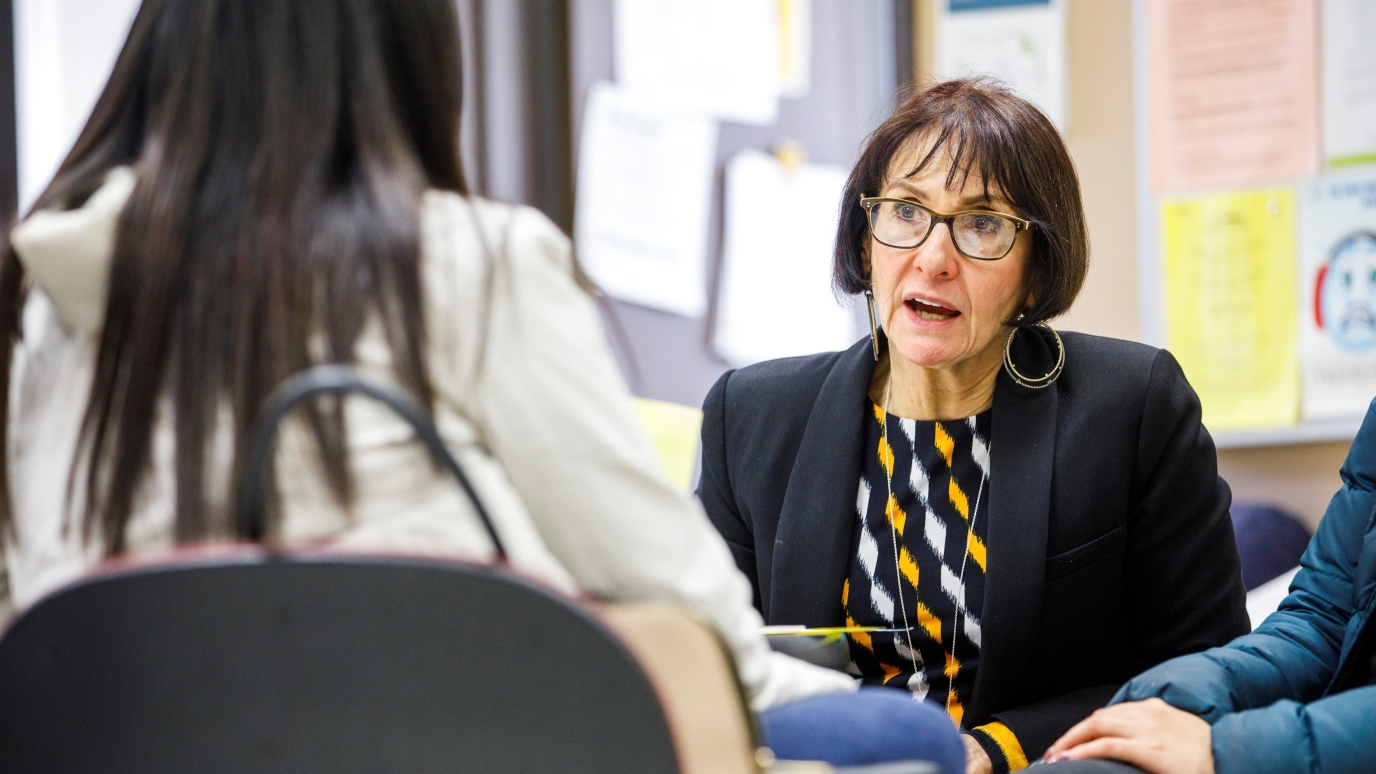 Distinguished Service Professor Laura Anker advising a student