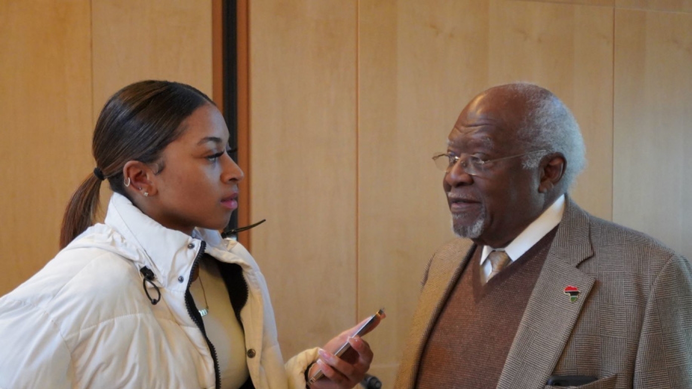 Dr. Julius Garvey Speaking at SUNY Old Westbury Photo of a SUNY Old Westbury Student speaking with Dr. Julius Garvey