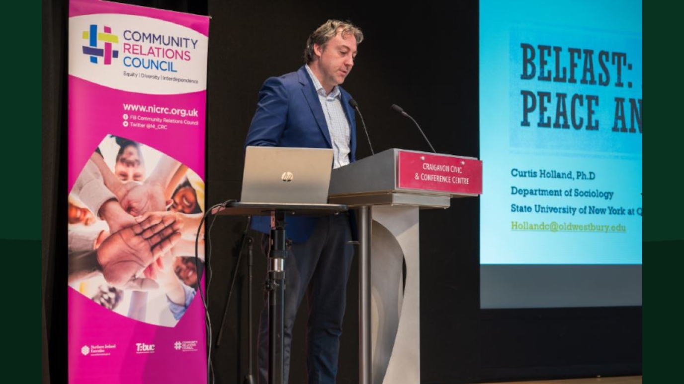 Dr. Curtis Holland at the Northern Ireland Community Relations Council’s "Together: Building a United Community" (T:BUC) Engagement Forum.