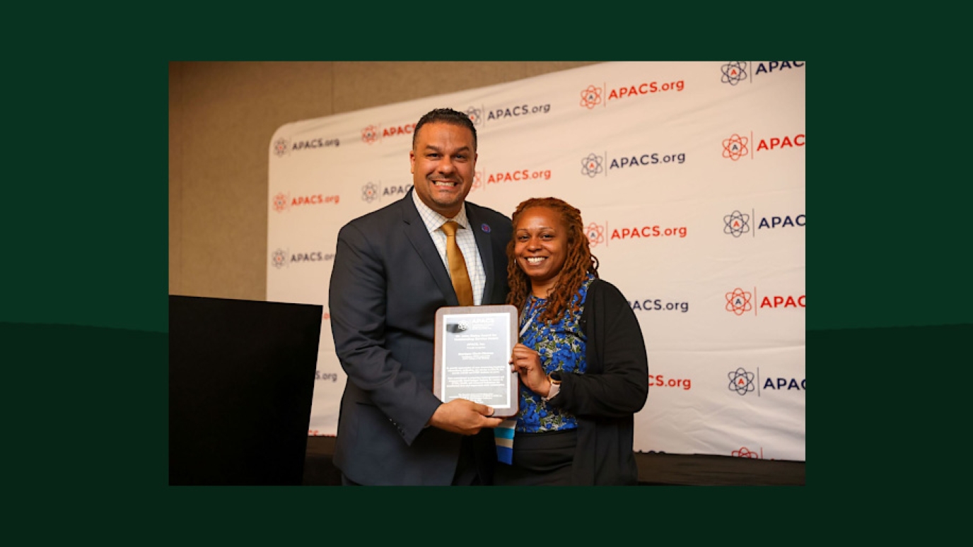 Dr. Renaldo D. Alba, President of the Association for Program Administrators of CSTEP and STEP, Inc. (APACS) presenting Monique Clark-Ciceron with her award.
