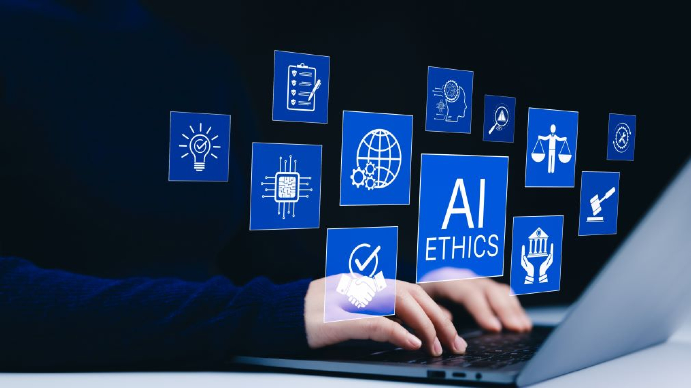 Photo illustration of hands on a keyboard superimposed with illustrations noting concepts involved in responsible artificial intelligence practices