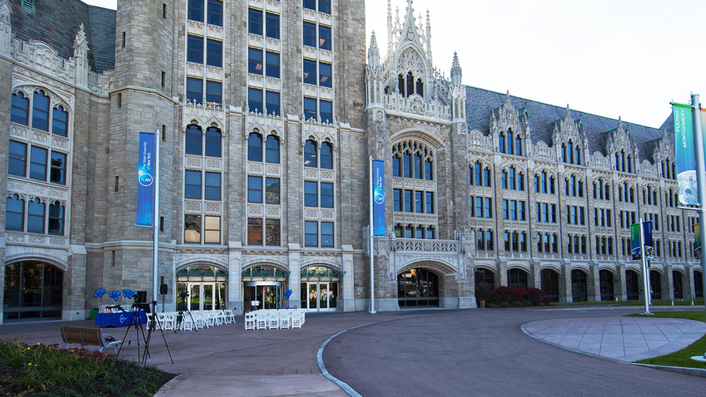 Gothic building with SUNY banners