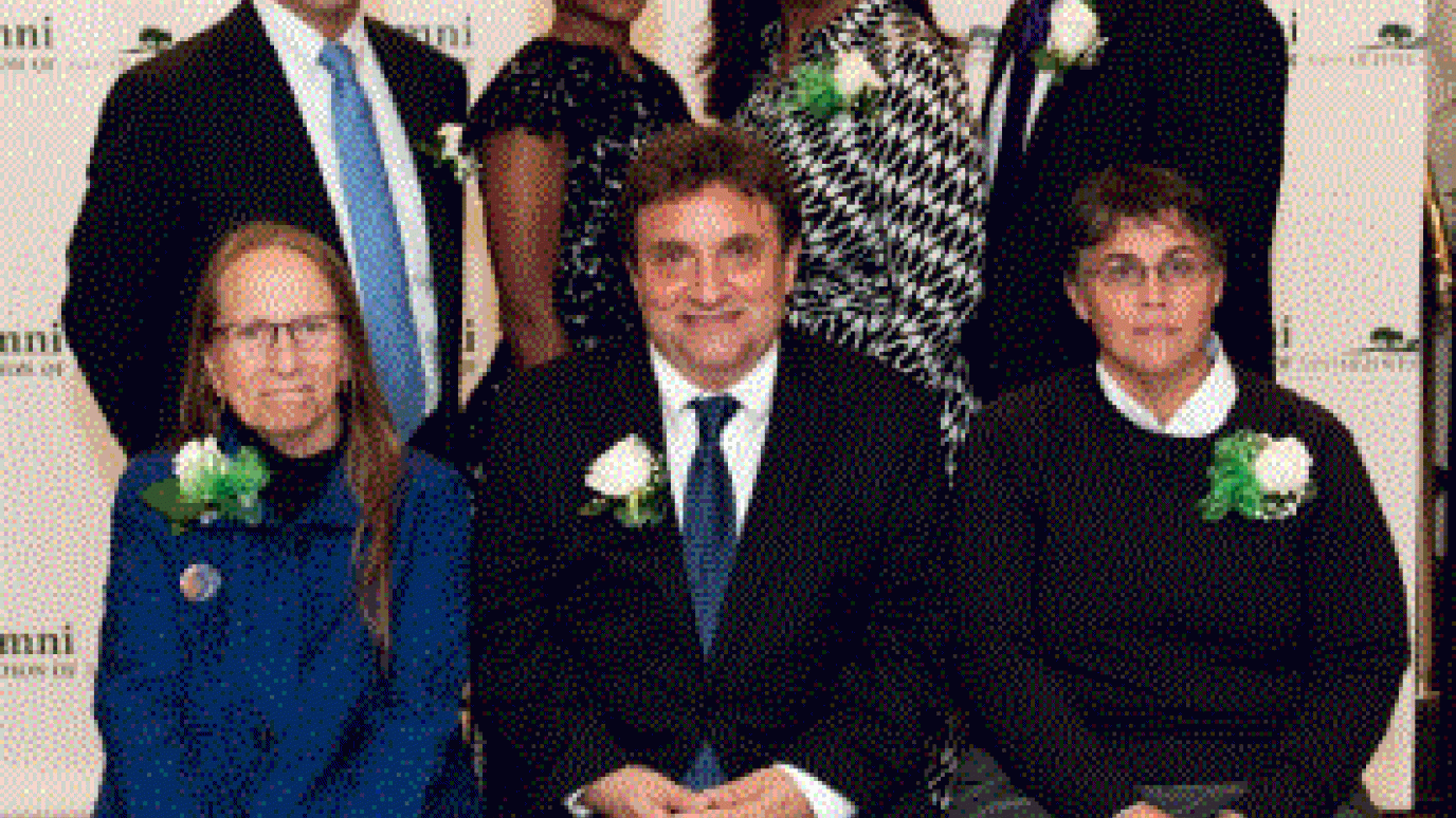 Photo of the 7 2019 honorees in front of the alumni association step-and-repeat