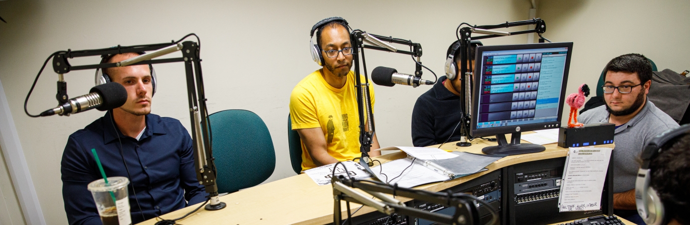 Four students in the campus radio station