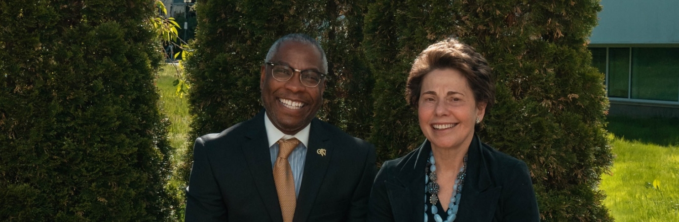 President Sams sits with Chair Tisch outside the Campus Center