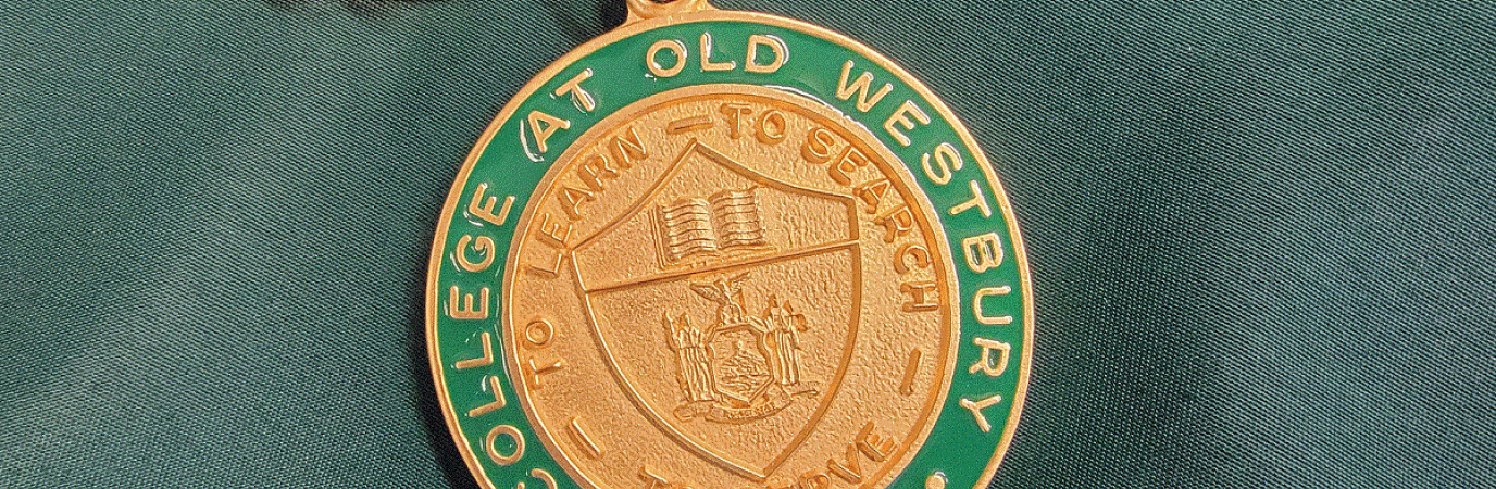 Green and gold president's medal on gold chain