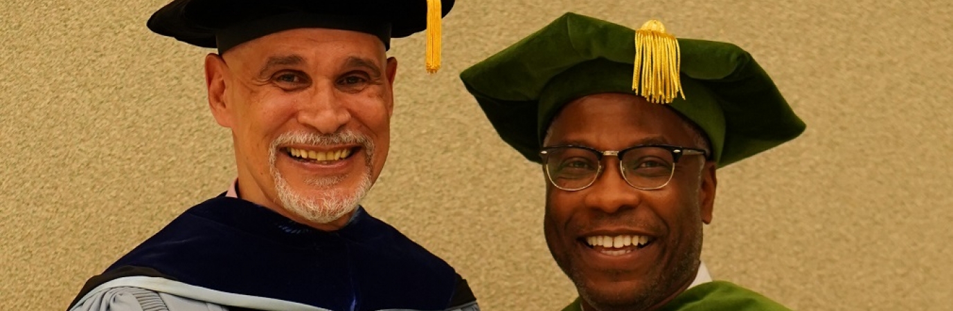 Professor Millan with President Sams in academic regalia