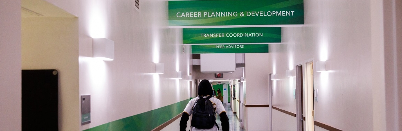 Student walking in Success Center Hallway
