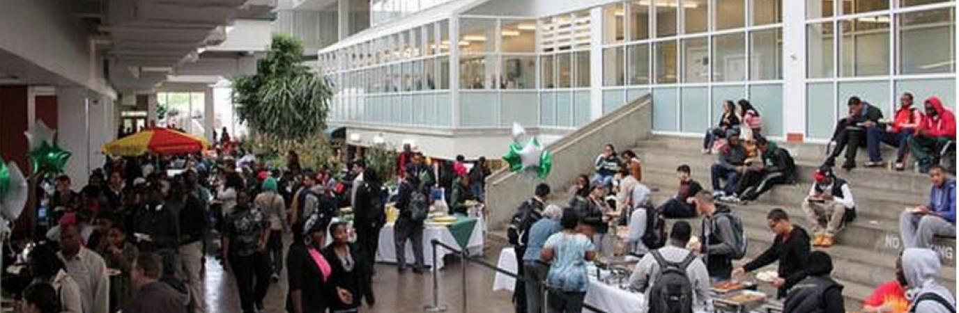 Students walking in the campus center atrium