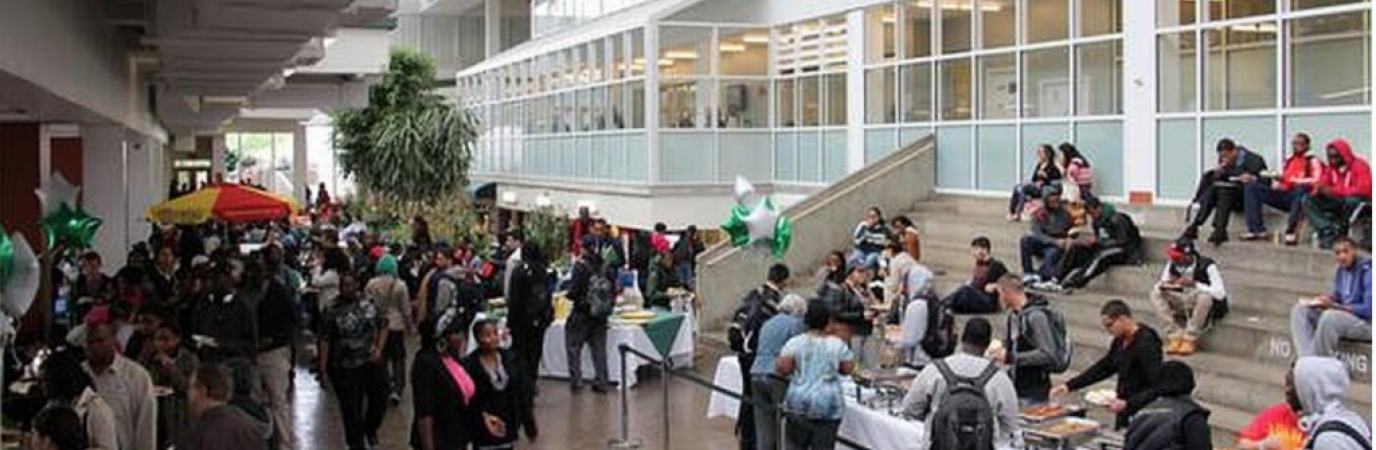 Students walking in the campus center atrium 