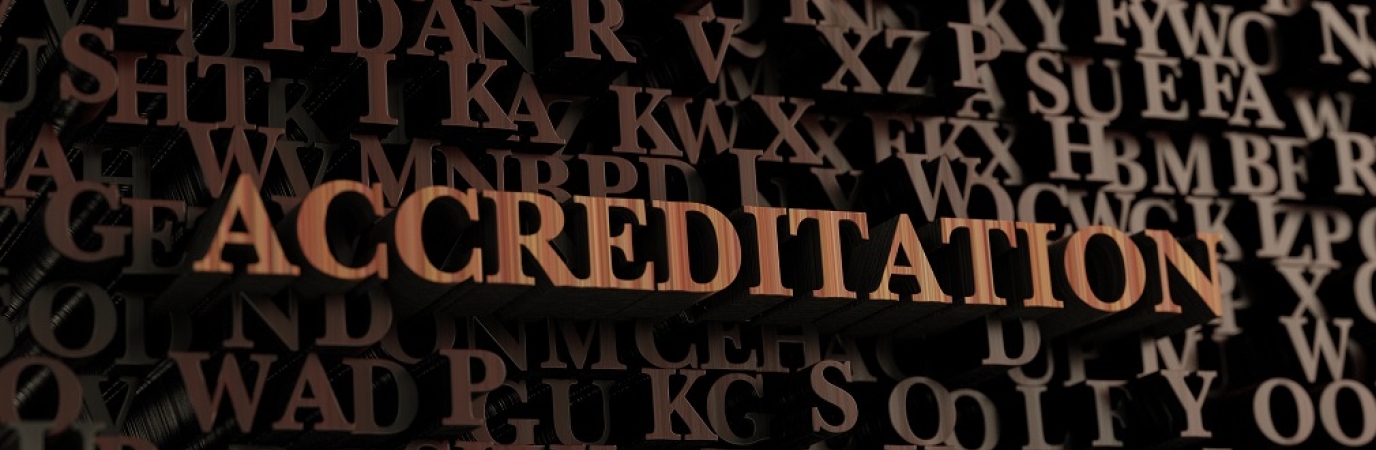 Jumbled brown letters with the word Accreditation highlighted
