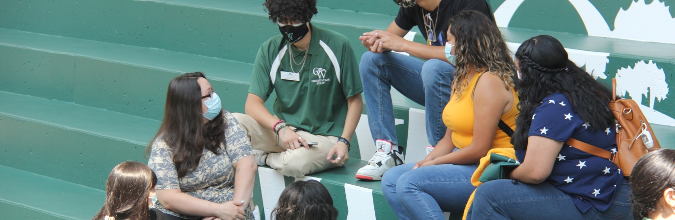 Orientation Leader and group are interacting on the Campus Center Steps