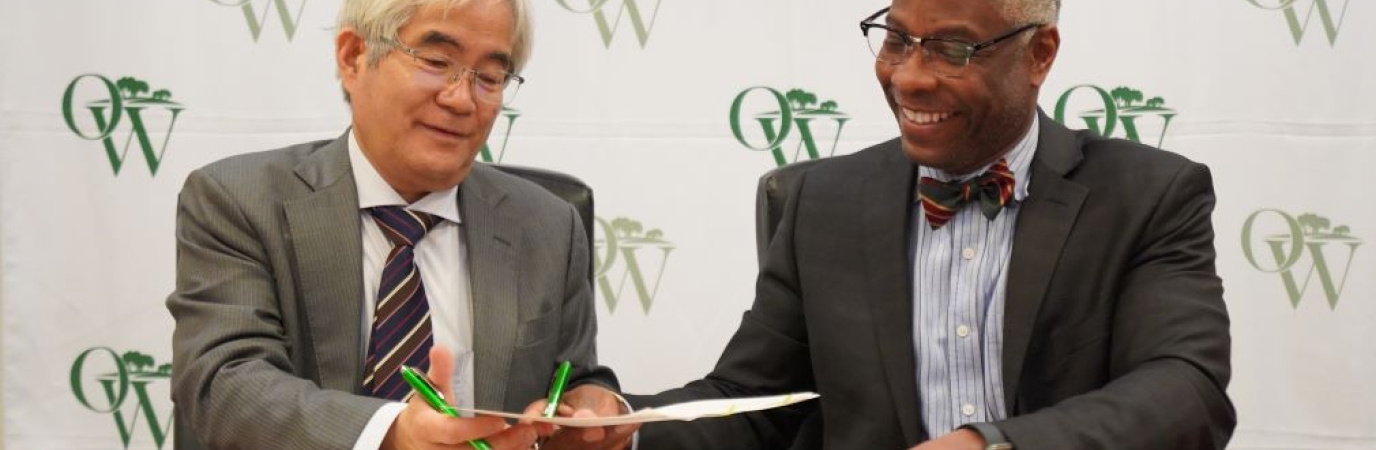 President Sams and Vice President Kanaguchi sign agreement