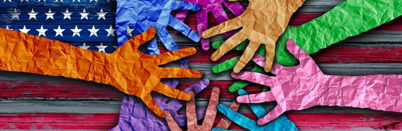 Photo illustration with hands of different colors meeting over an American Flag