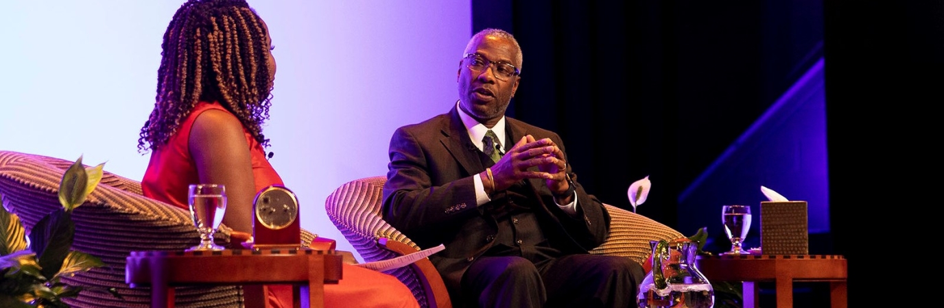 President Sams on stage in the Maguire Theater being interviewed by CNN's Eva McKend