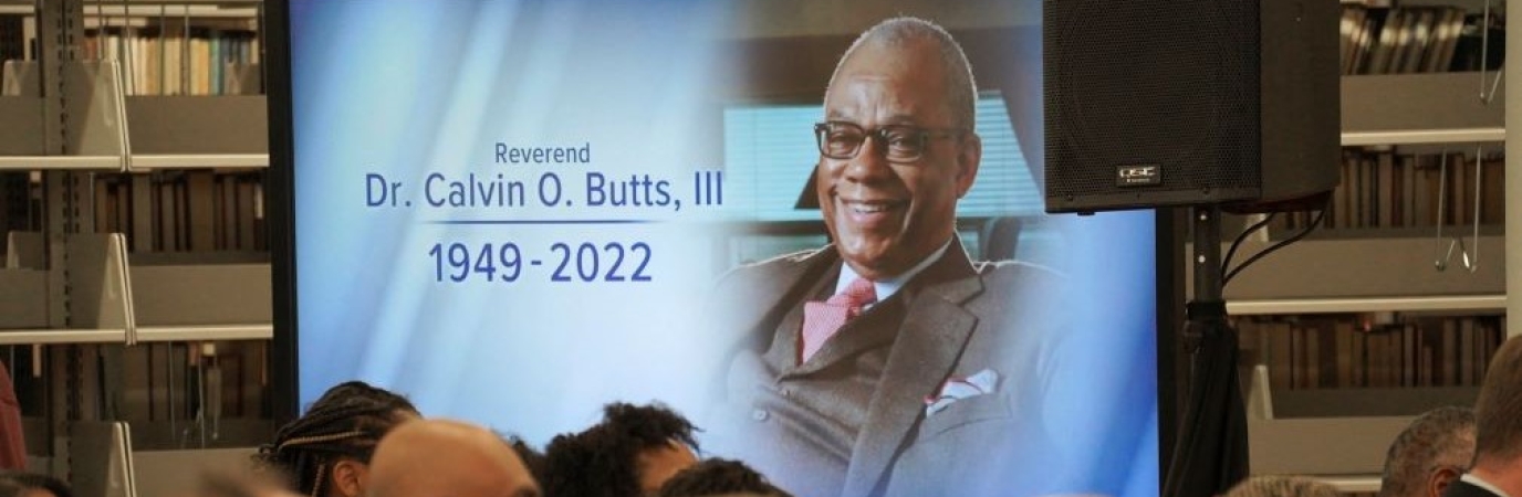 image on LED screen of Dr. Butts with the dates of his birth and death