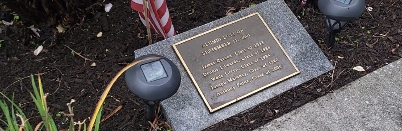Plaque listing the names of five alumni lost on 9/11/01