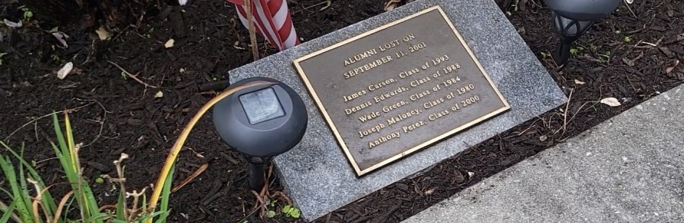 Plaque listing the names of five alumni lost on 9/11/01