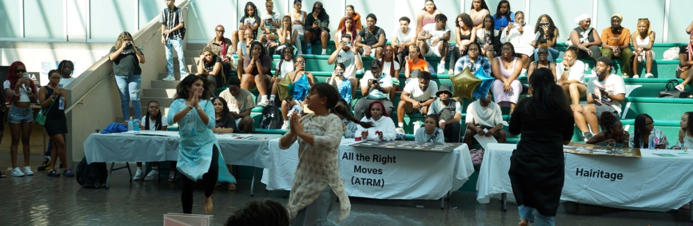 Students perform in the Atrium before and audience of other students