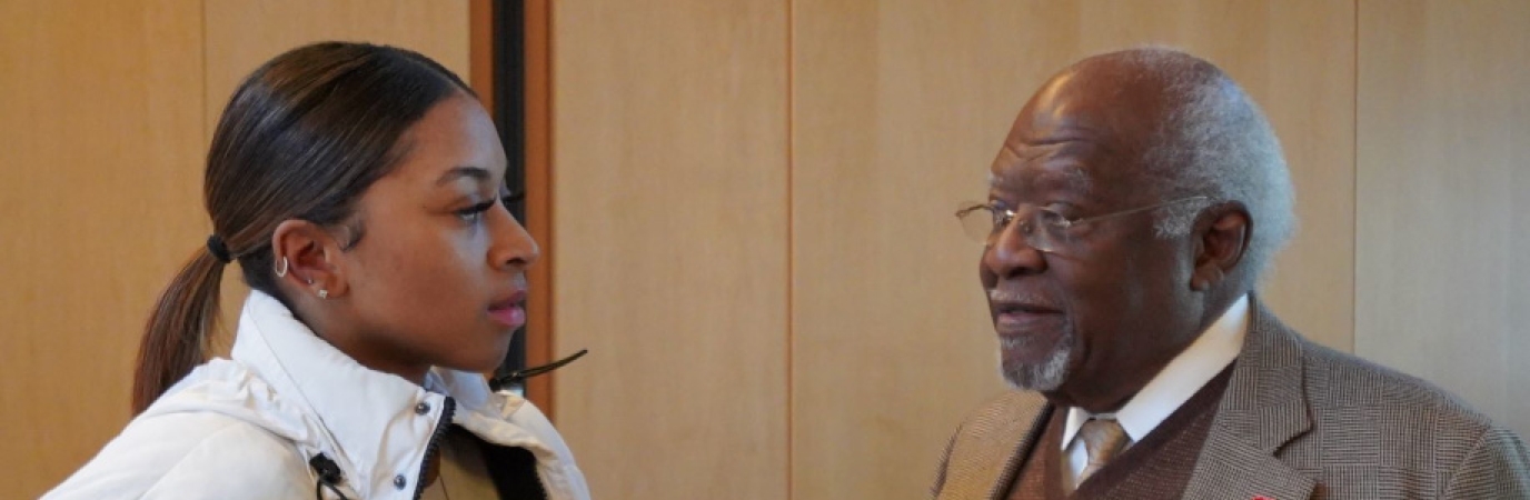 Dr. Julius Garvey Speaking at SUNY Old Westbury Photo of a SUNY Old Westbury Student speaking with Dr. Julius Garvey